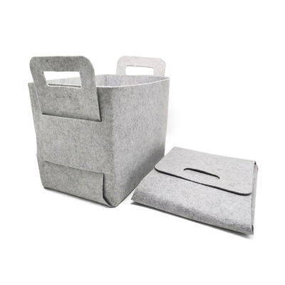 Des paniers de rangement personnalisés et modernes sont installés dans des contenants en feutre de polyester à 100% pour organiser les articles ménagers.